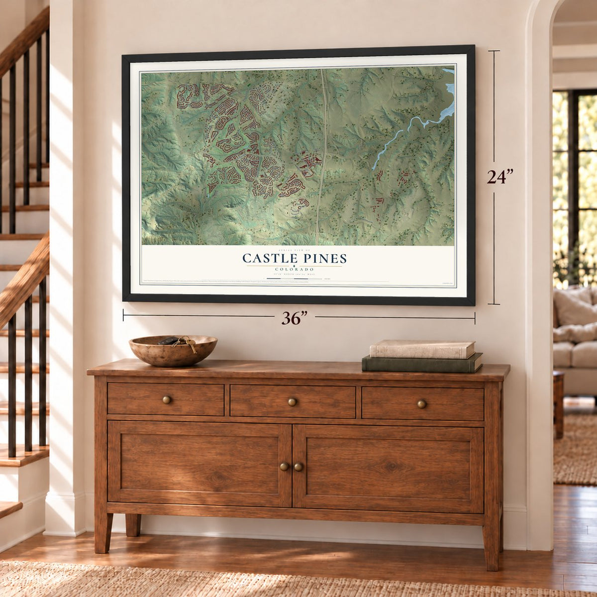 Castle Pines, Colorado map, 24 x 36 inch print in a black frame above a dresser by a staircase