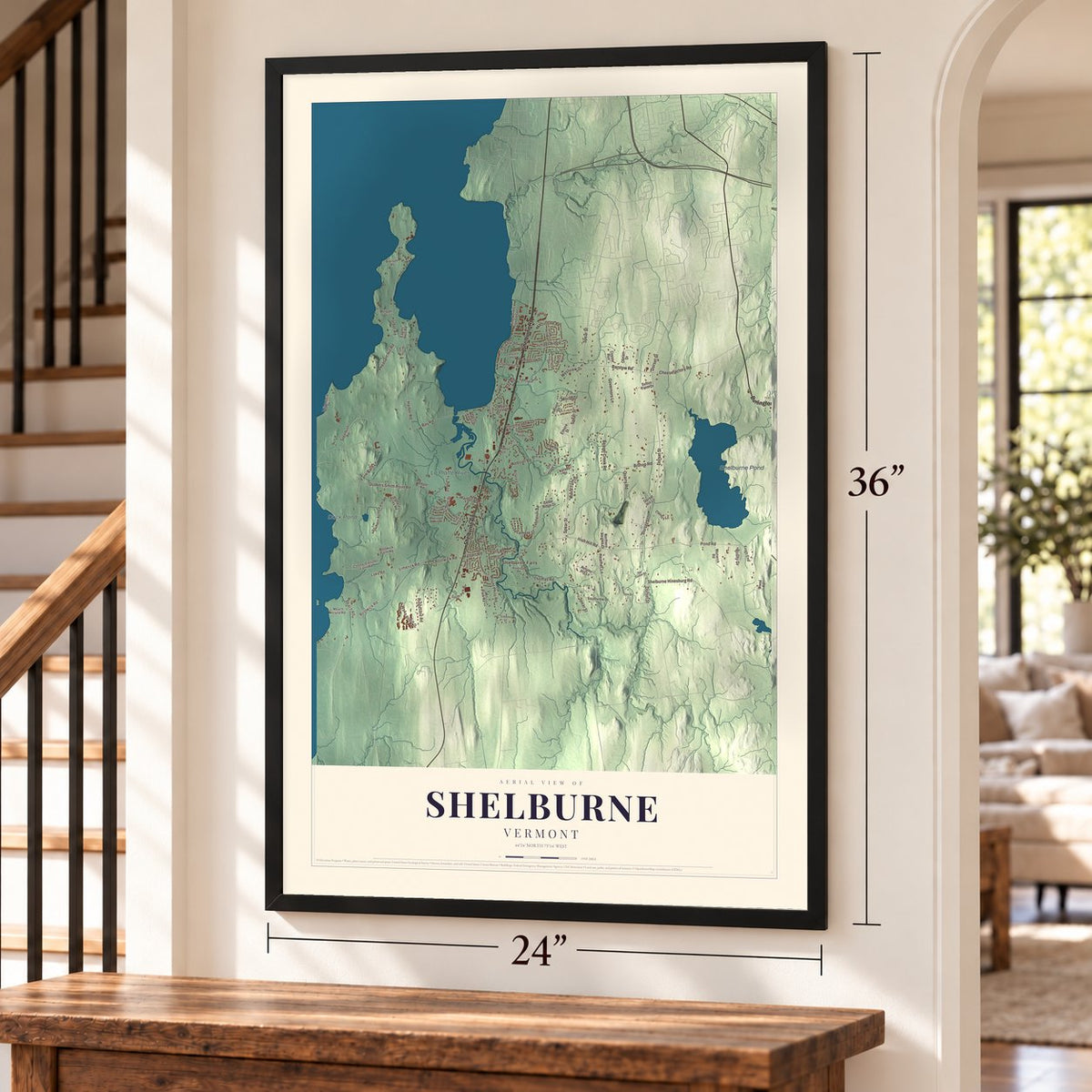 Shelburne, Vermont map, 24 x 36 inch print in a black frame by a staircase