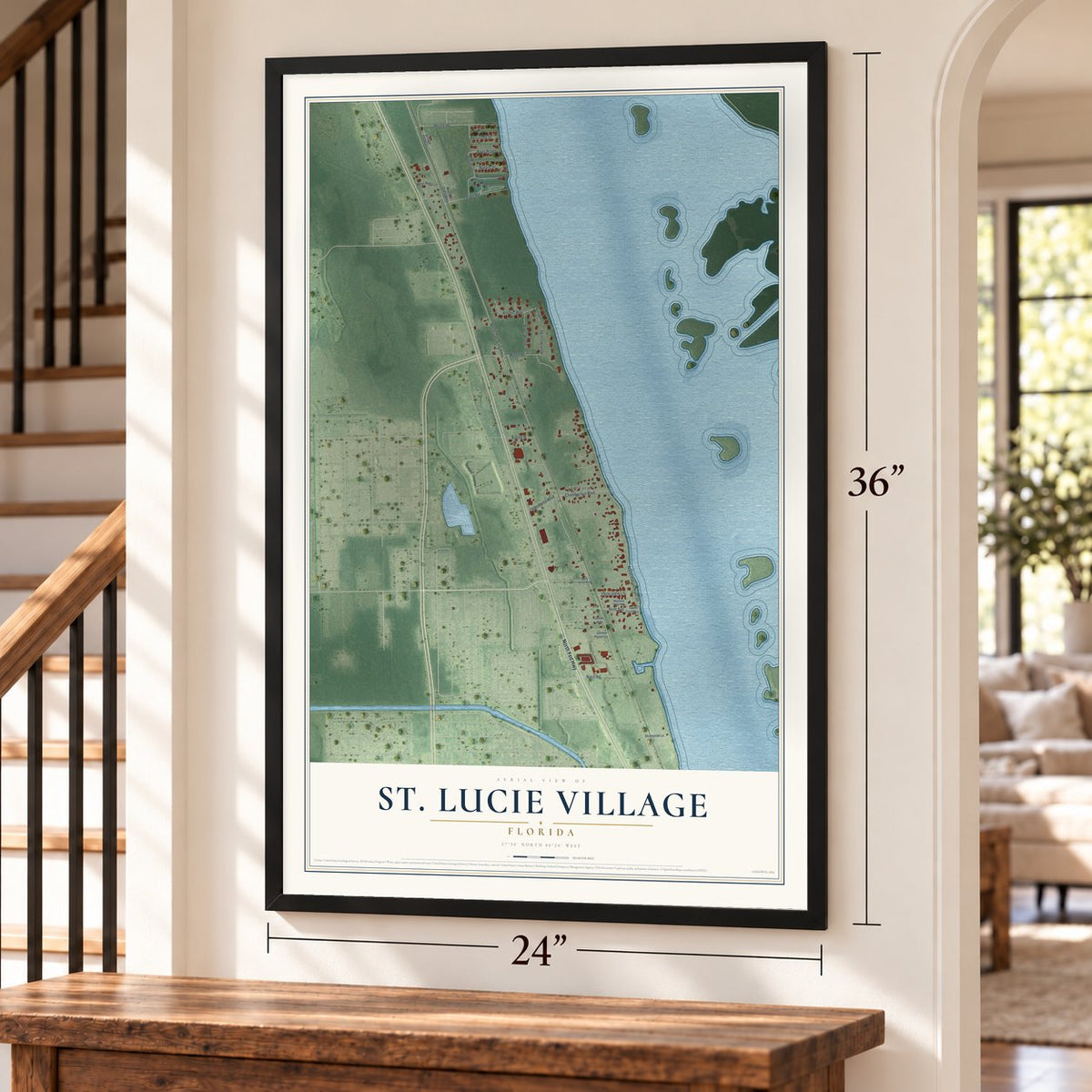 St. Lucie Village, Florida map, 24 x 36 inch print in a black frame by a staircase