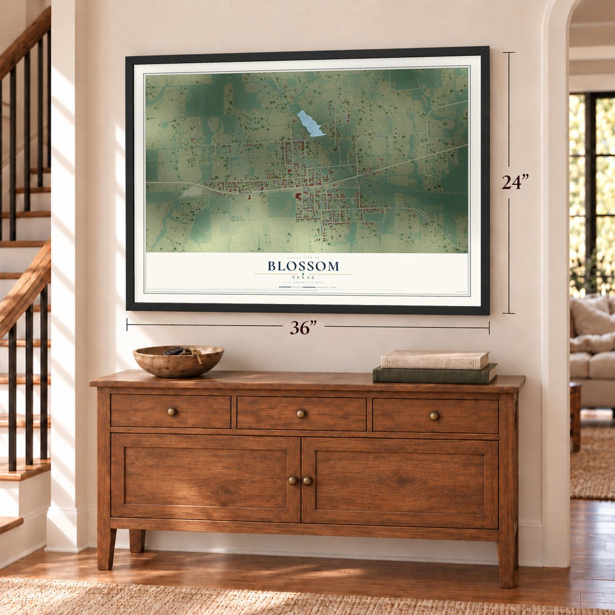 Blossom, Texas map, 24 x 36 inch print in a black frame above a dresser by a staircase