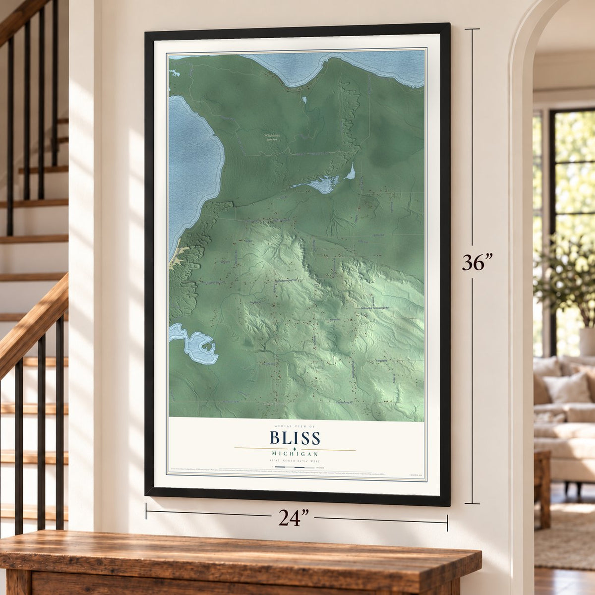 Bliss, Michigan map, 24 x 36 inch print in a black frame by a staircase