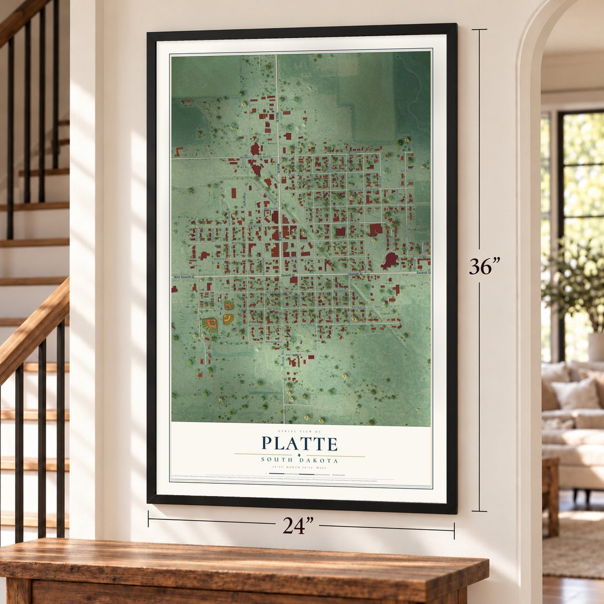 Platte, South Dakota map, 24 x 36 inch print in a black frame by a staircase