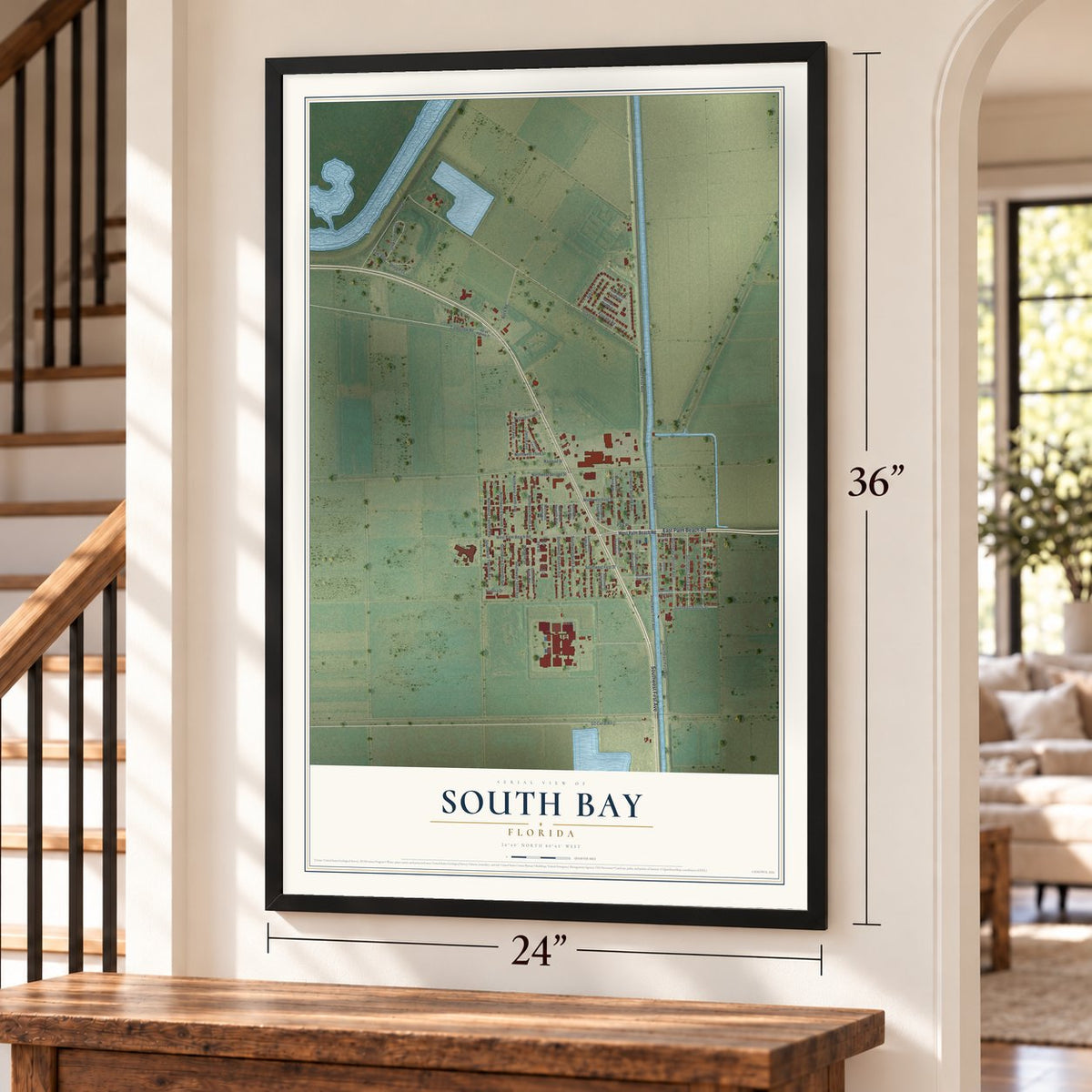 South Bay, Florida map, 24 x 36 inch print in a black frame by a staircase