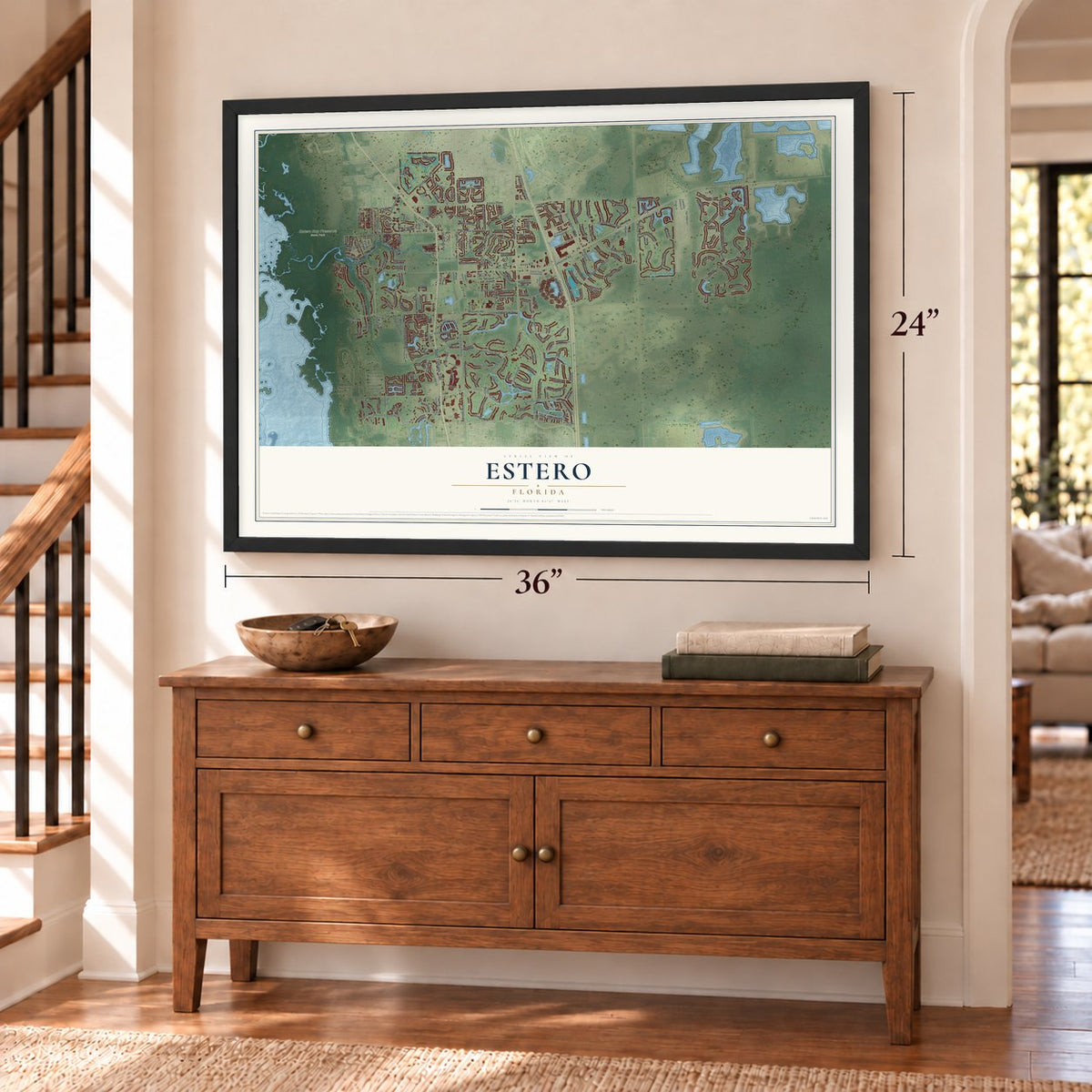 Estero, Florida map, 24 x 36 inch print in a black frame above a dresser by a staircase