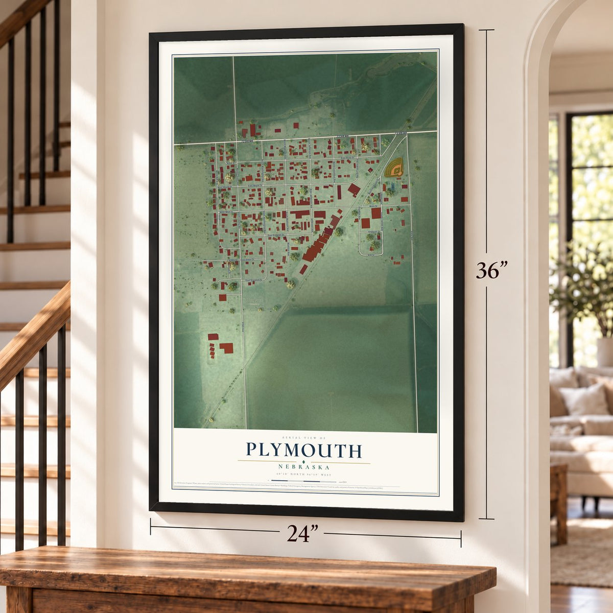 Plymouth, Nebraska map, 24 x 36 inch print in a black frame by a staircase