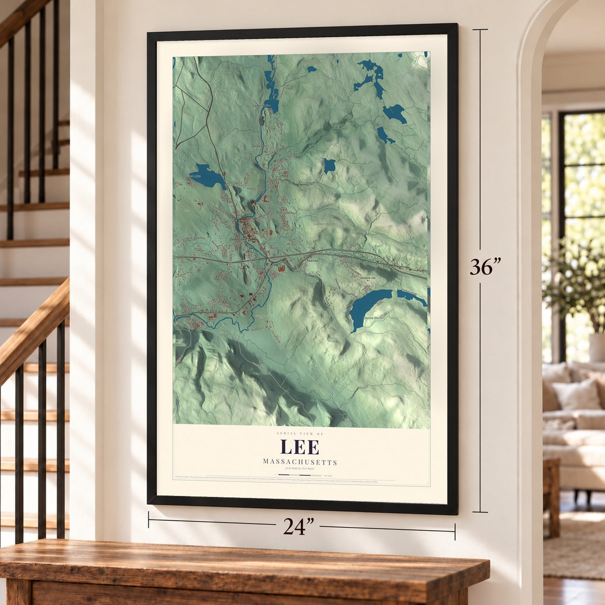 Lee, Massachusetts map, 24 x 36 inch print in a black frame by a staircase