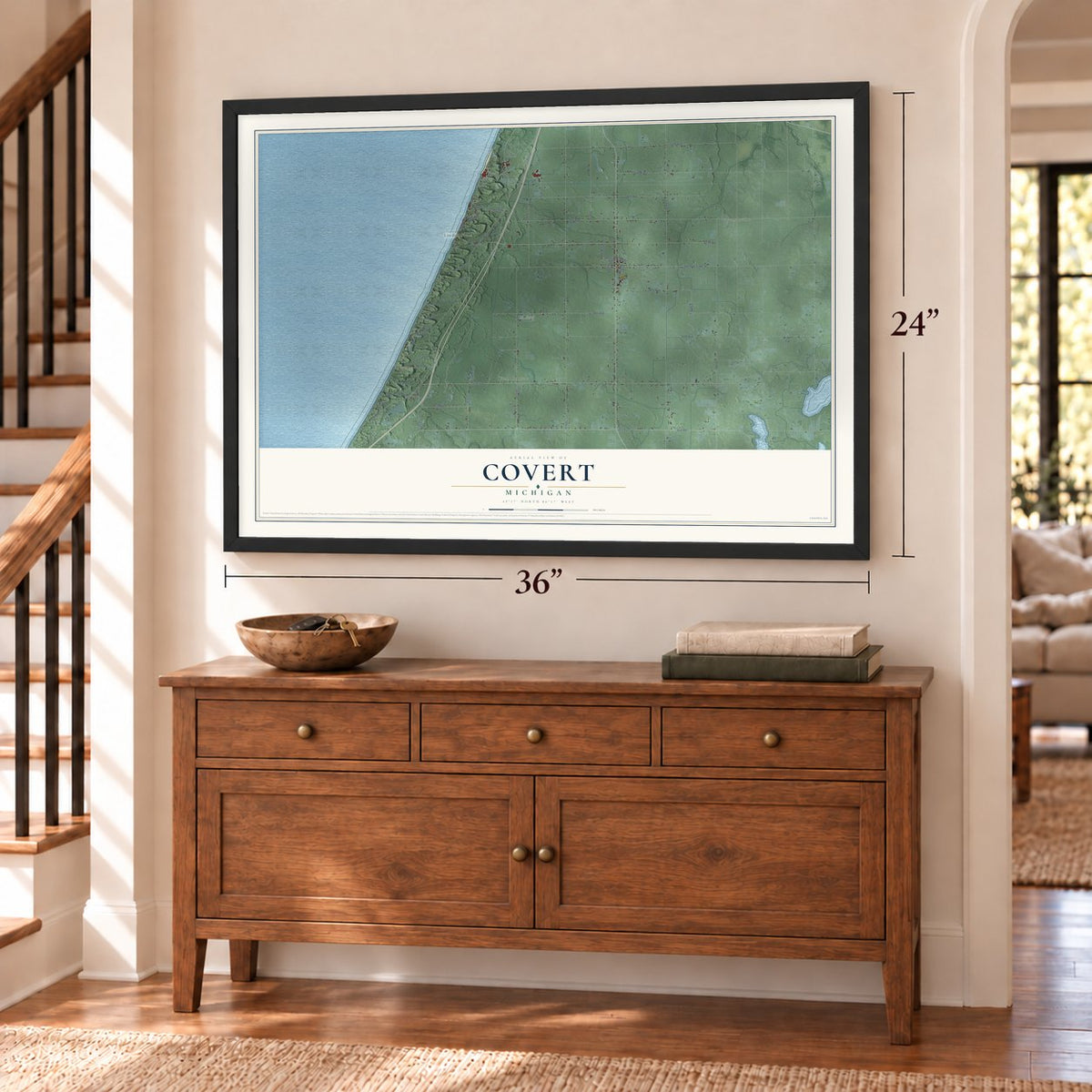 Covert, Michigan map, 24 x 36 inch print in a black frame above a dresser by a staircase