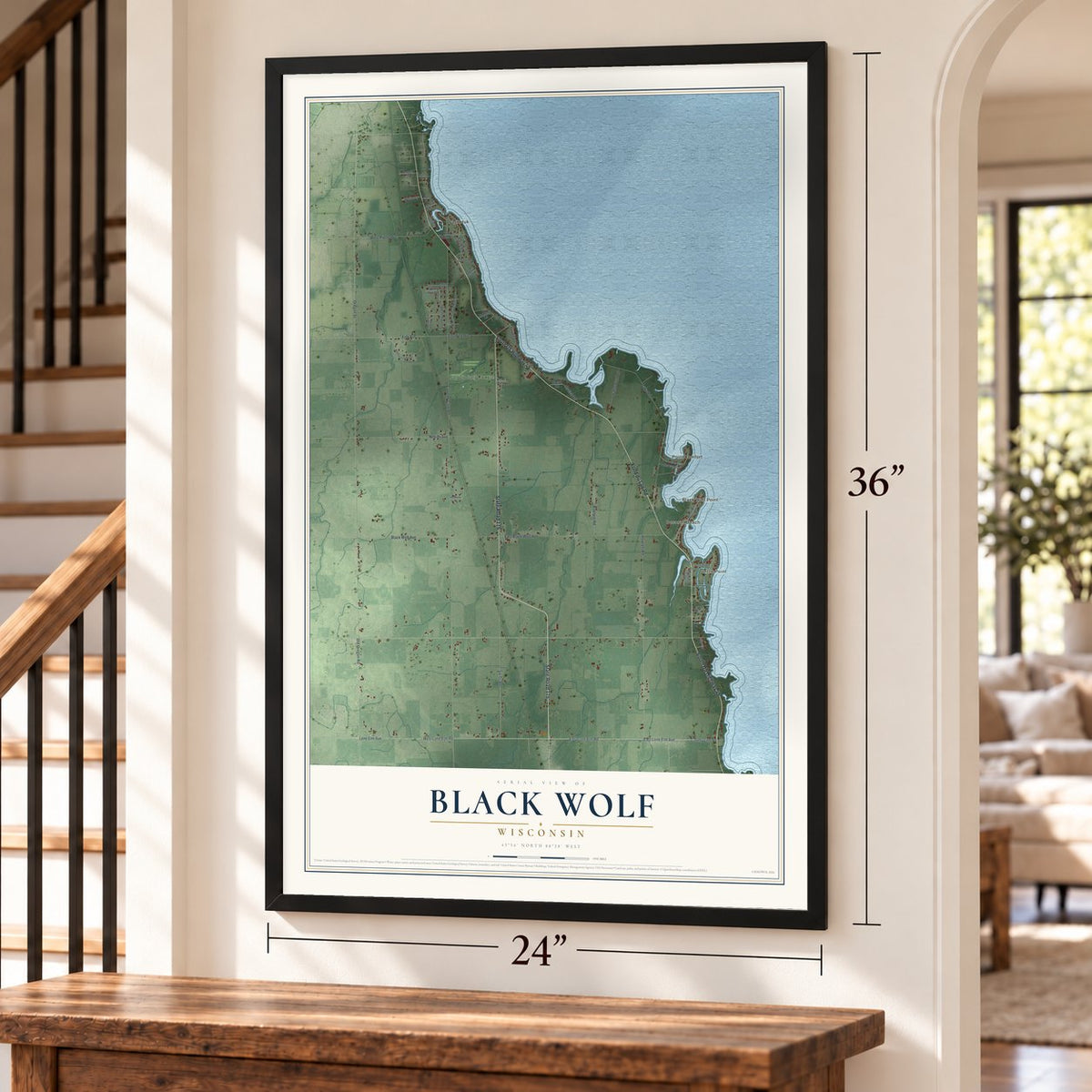 Black Wolf, Wisconsin map, 24 x 36 inch print in a black frame by a staircase