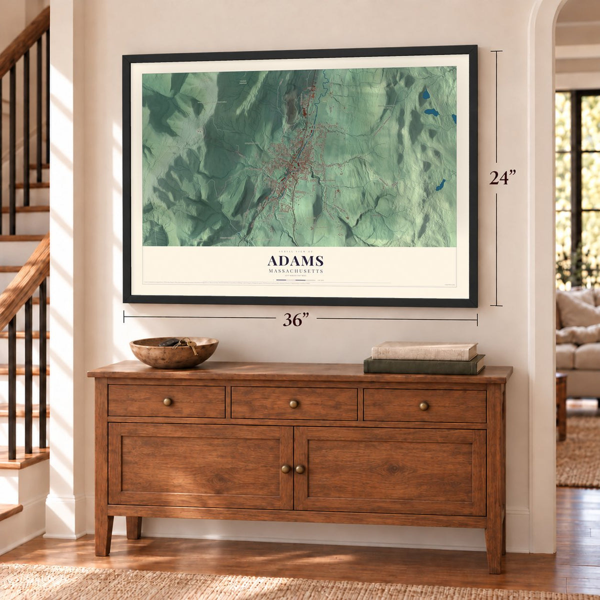 Adams, Massachusetts map, 24 x 36 inch print in a black frame above a dresser by a staircase