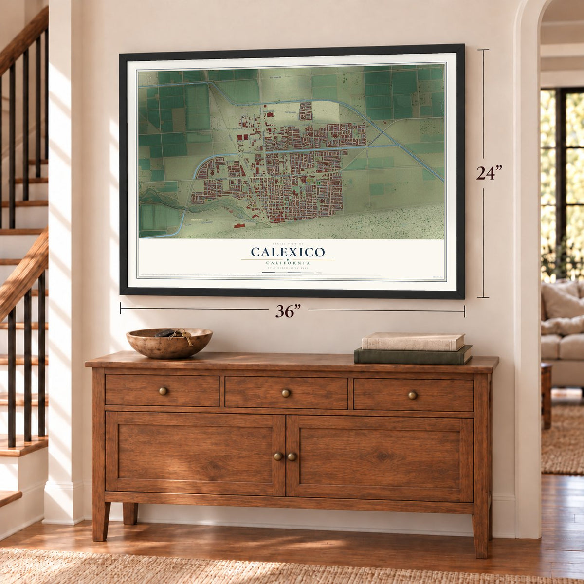 Calexico, California map, 24 x 36 inch print in a black frame above a dresser by a staircase