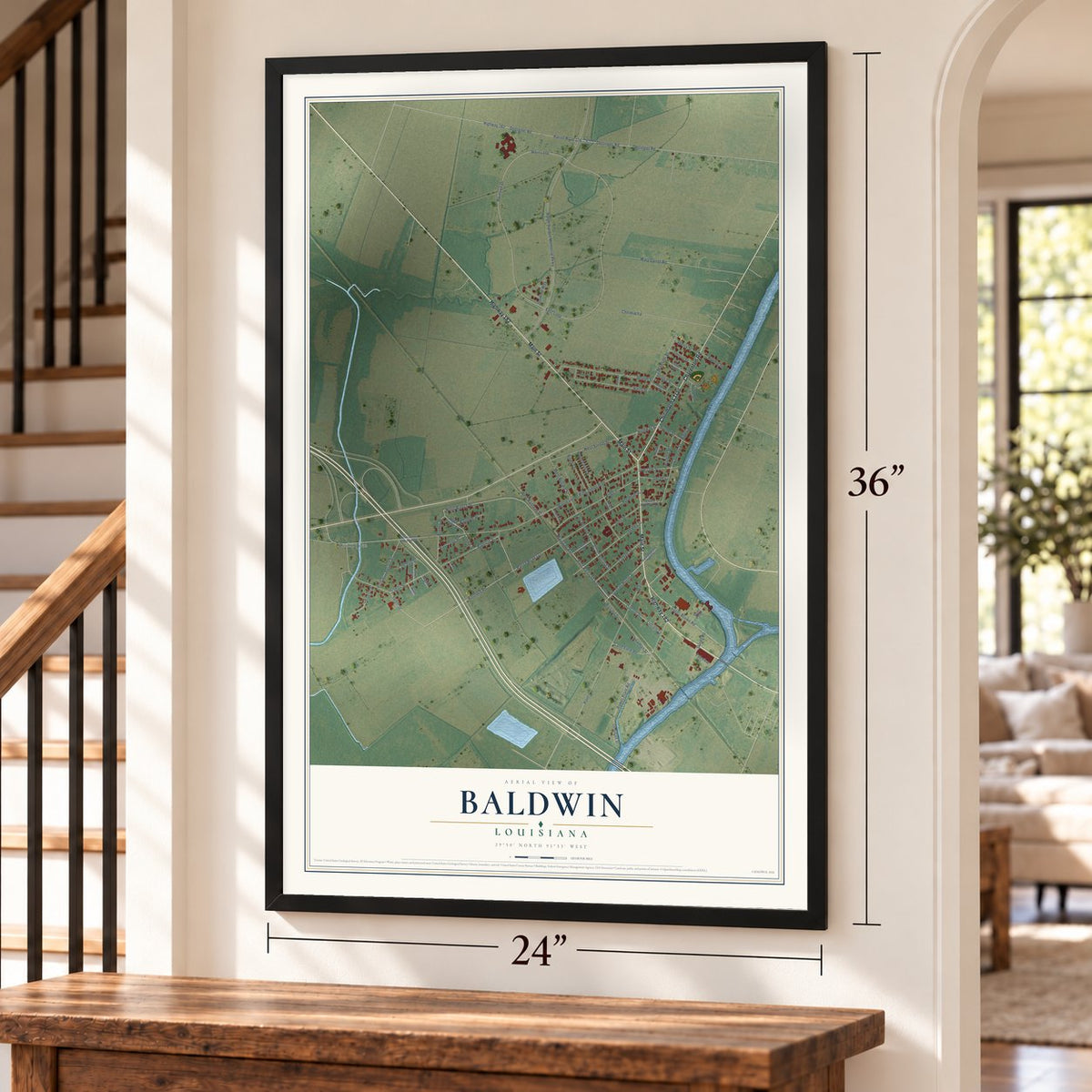Baldwin, Louisiana map, 24 x 36 inch print in a black frame by a staircase