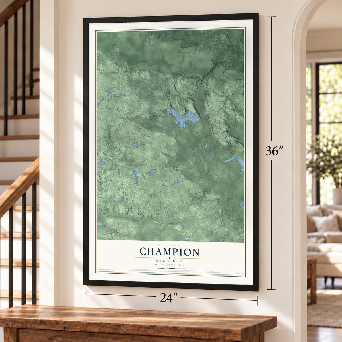 Champion, Michigan map, 24 x 36 inch print in a black frame by a staircase
