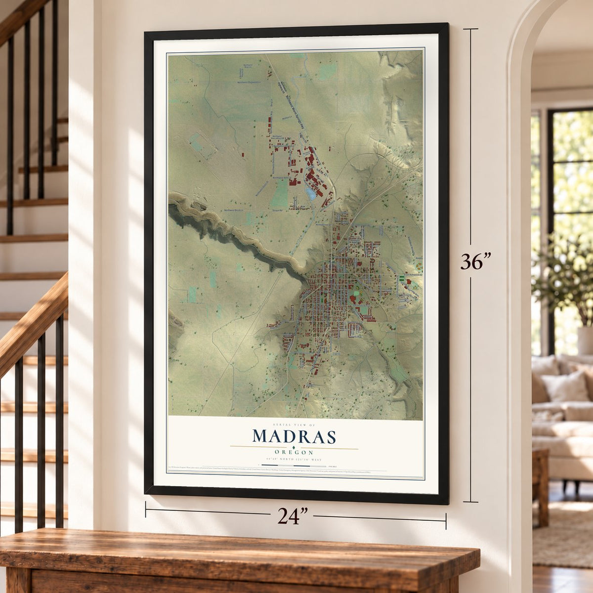Madras, Oregon map, 24 x 36 inch print in a black frame by a staircase