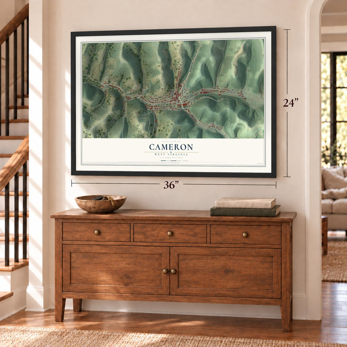 Cameron, West Virginia map, 24 x 36 inch print in a black frame above a dresser by a staircase
