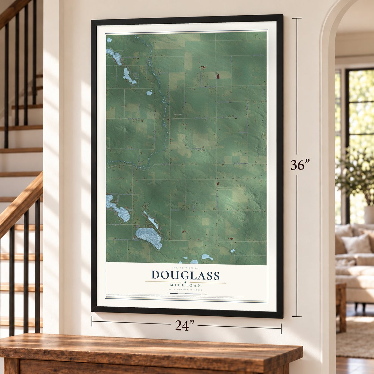 Douglass, Michigan map, 24 x 36 inch print in a black frame by a staircase