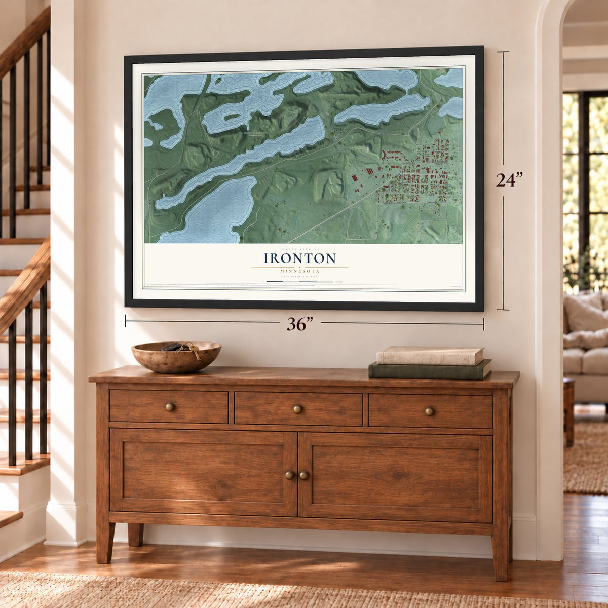Ironton, Minnesota map, 24 x 36 inch print in a black frame above a dresser by a staircase