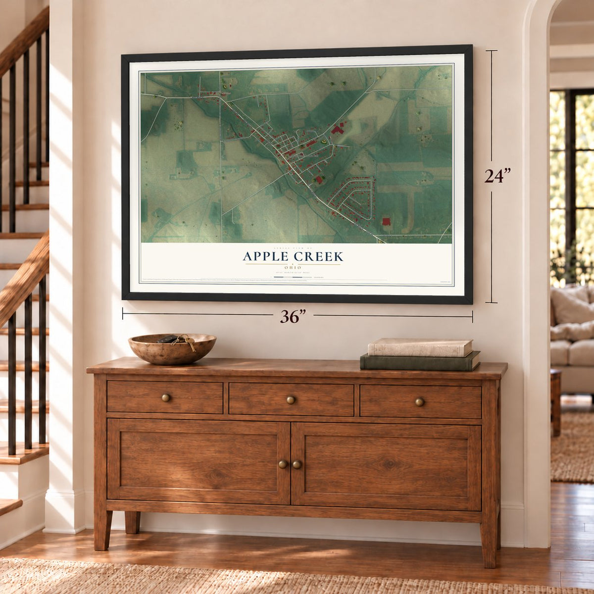 Apple Creek, Ohio map, 24 x 36 inch print in a black frame above a dresser by a staircase