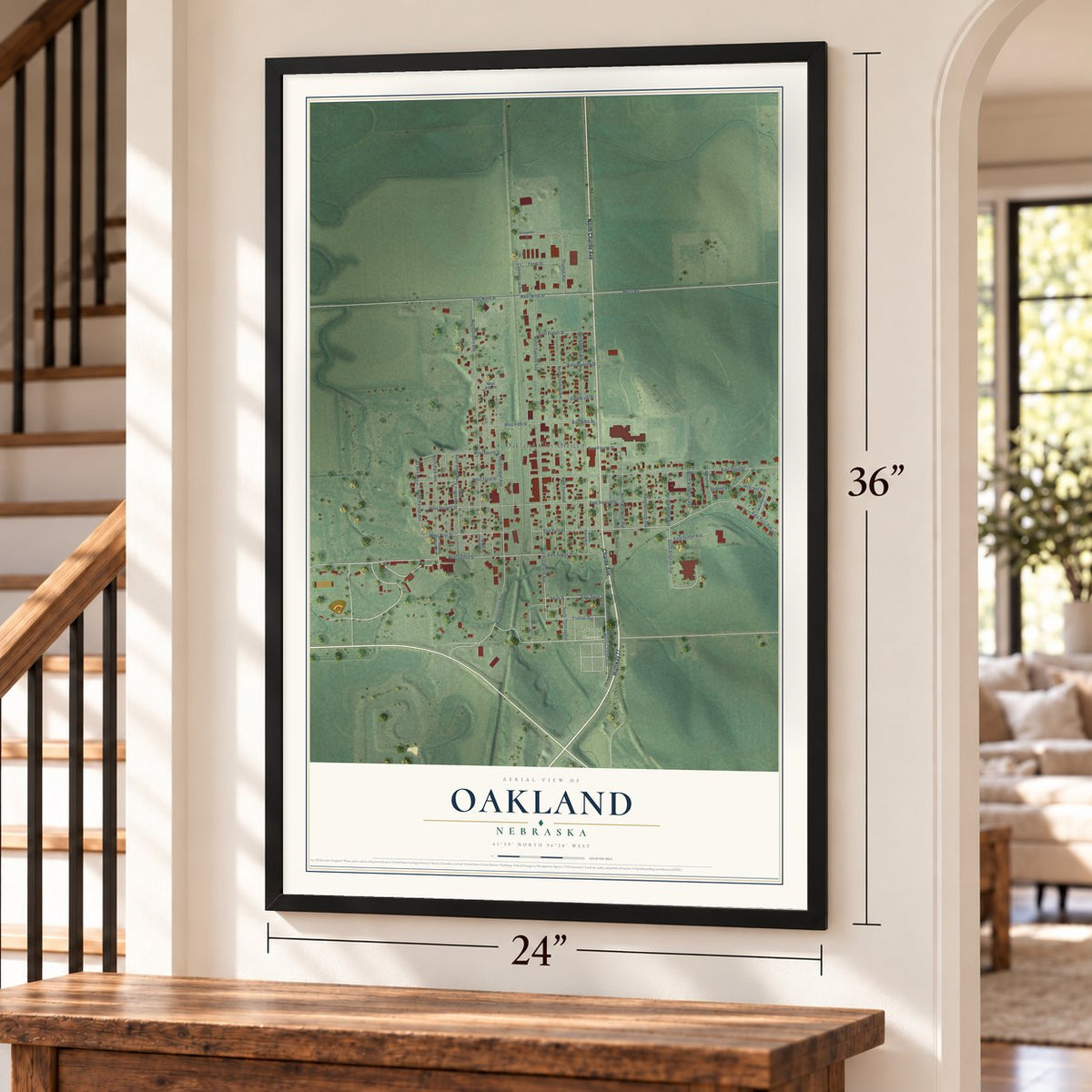 Oakland, Nebraska map, 24 x 36 inch print in a black frame by a staircase