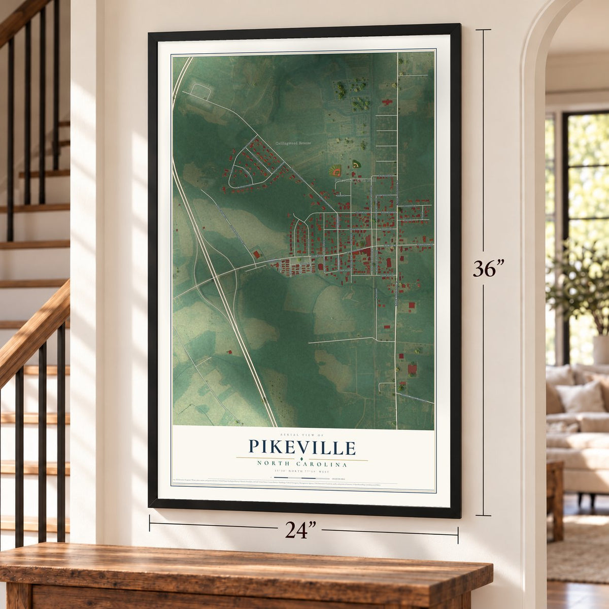 Pikeville, North Carolina map, 24 x 36 inch print in a black frame by a staircase
