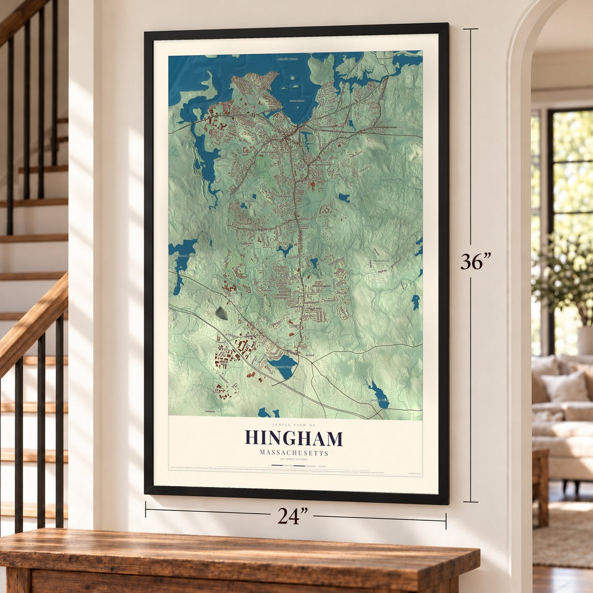 Hingham, Massachusetts map, 24 x 36 inch print in a black frame by a staircase