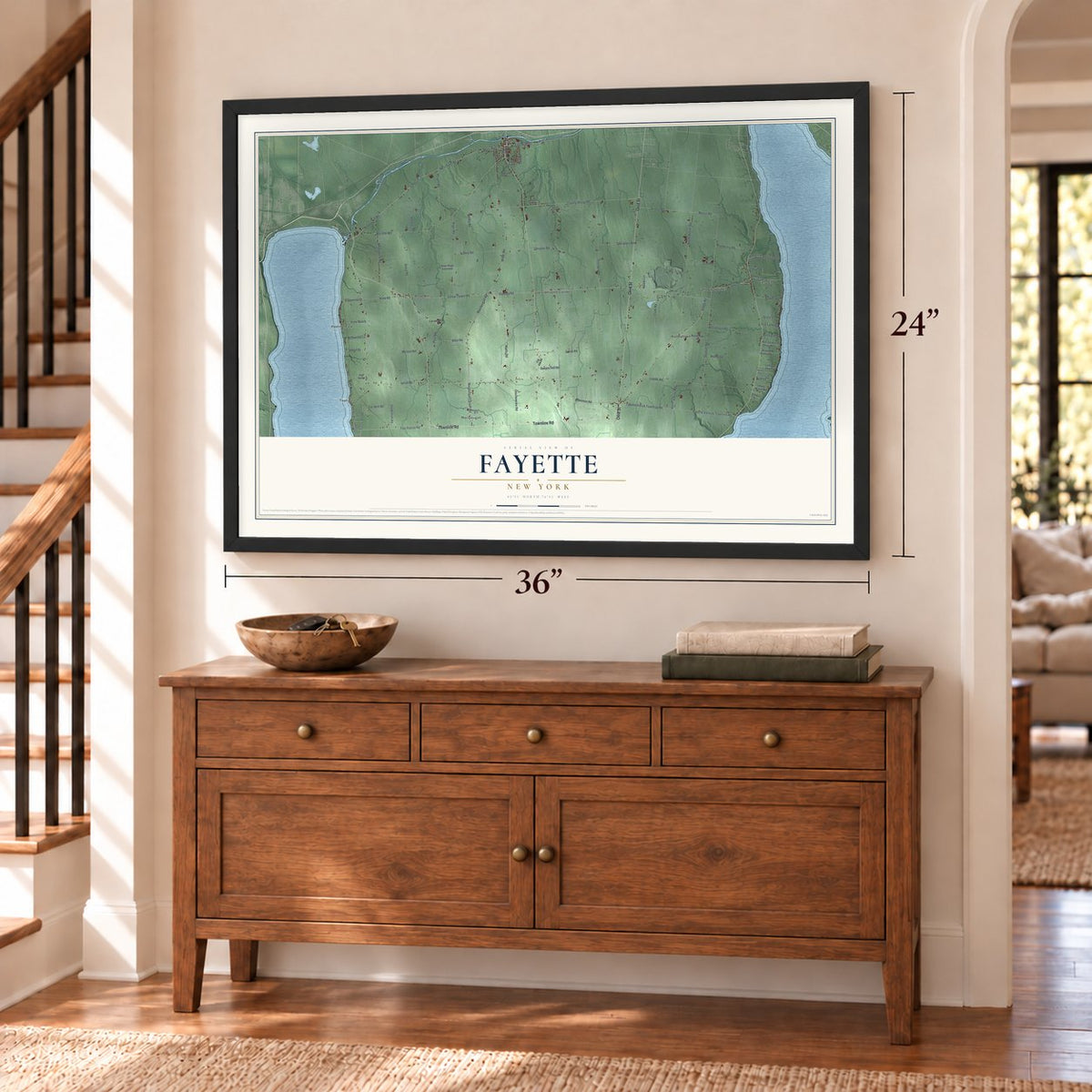Fayette, New York map, 24 x 36 inch print in a black frame above a dresser by a staircase
