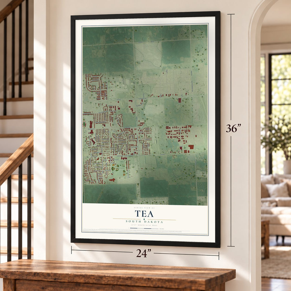 Tea, South Dakota map, 24 x 36 inch print in a black frame by a staircase