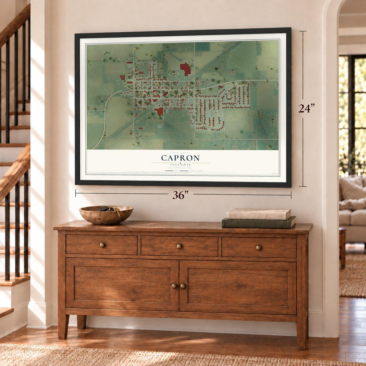 Capron, Illinois map, 24 x 36 inch print in a black frame above a dresser by a staircase