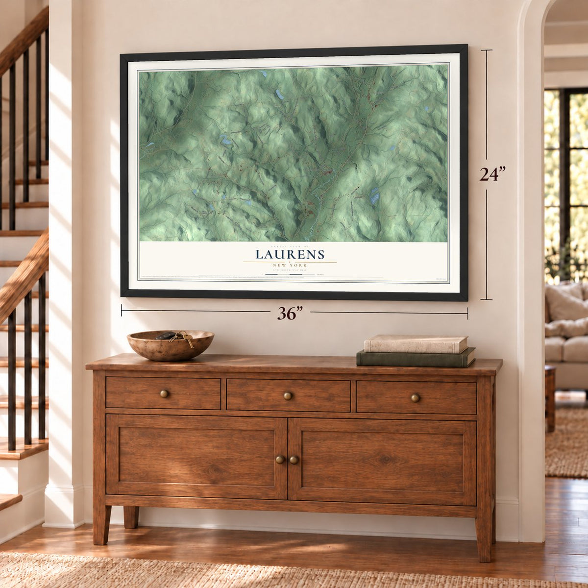 Laurens, New York map, 24 x 36 inch print in a black frame above a dresser by a staircase