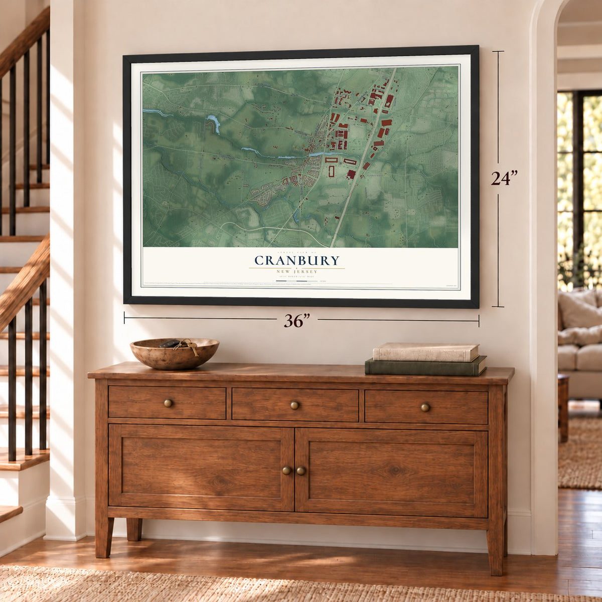 Cranbury, New Jersey map, 24 x 36 inch print in a black frame above a dresser by a staircase
