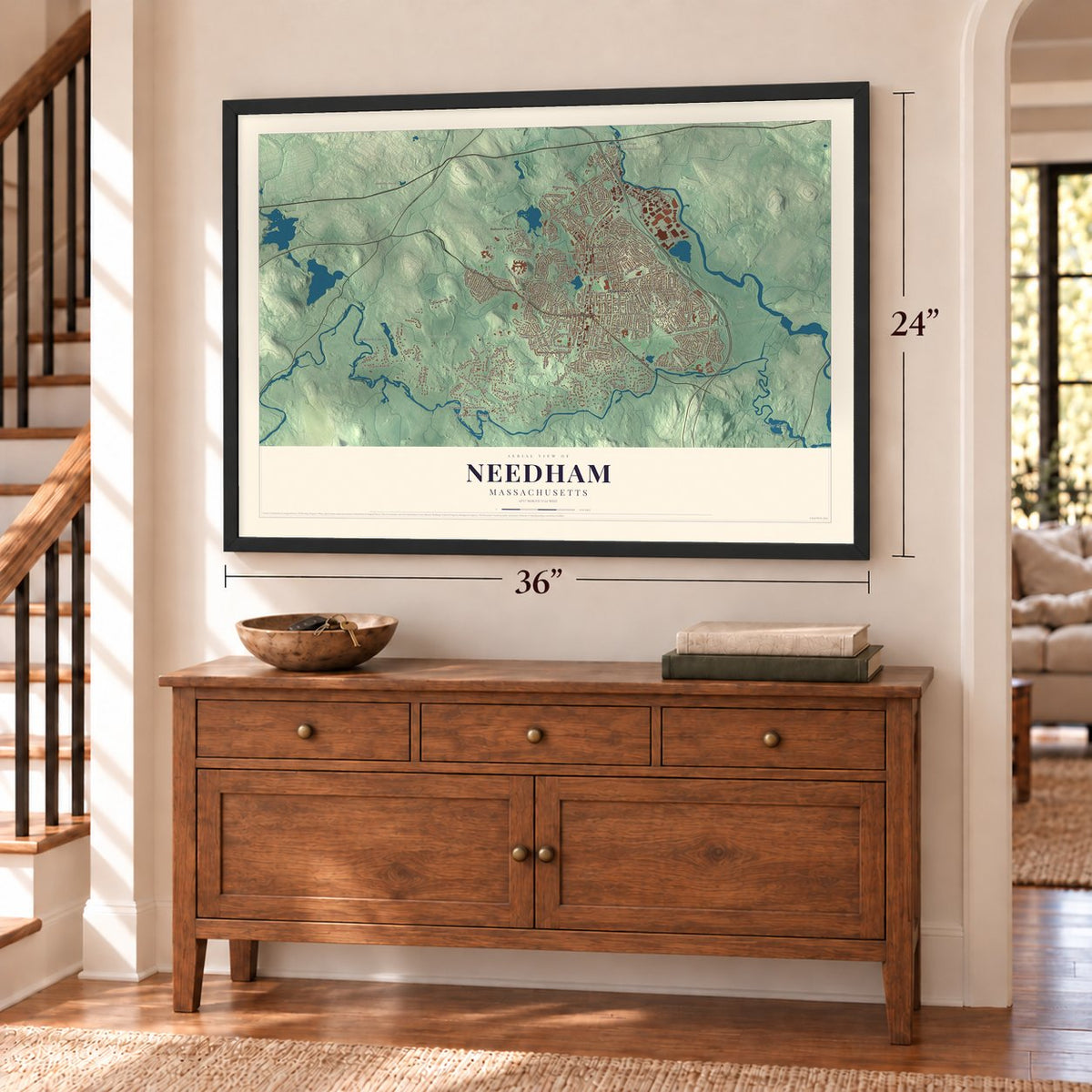 Needham, Massachusetts map, 24 x 36 inch print in a black frame above a dresser by a staircase