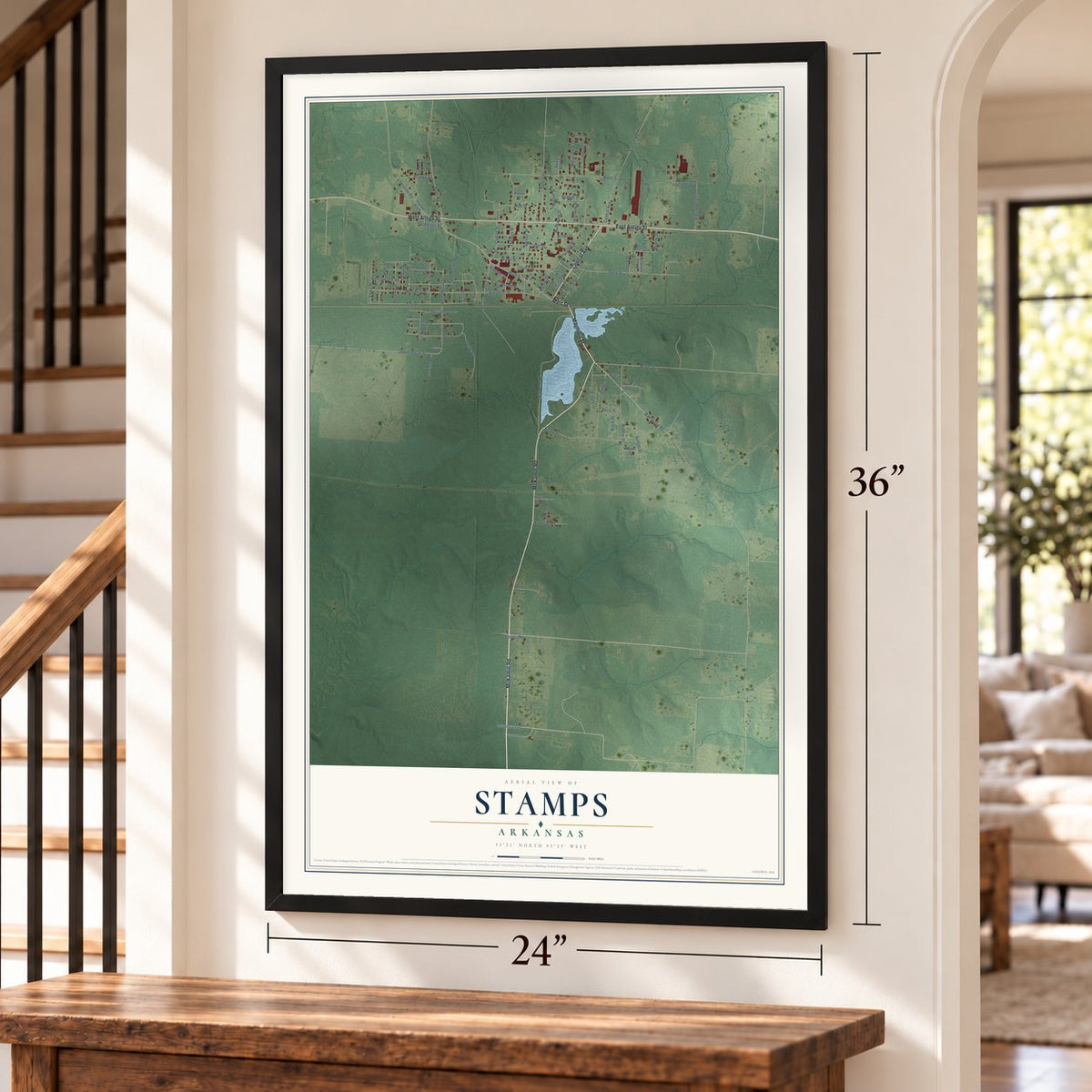 Stamps, Arkansas map, 24 x 36 inch print in a black frame by a staircase