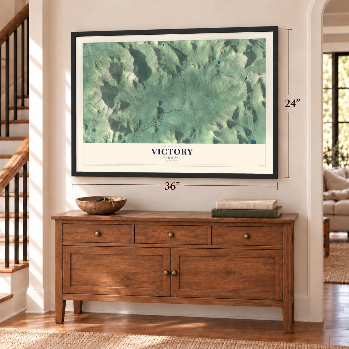 Victory, Vermont map, 24 x 36 inch print in a black frame above a dresser by a staircase