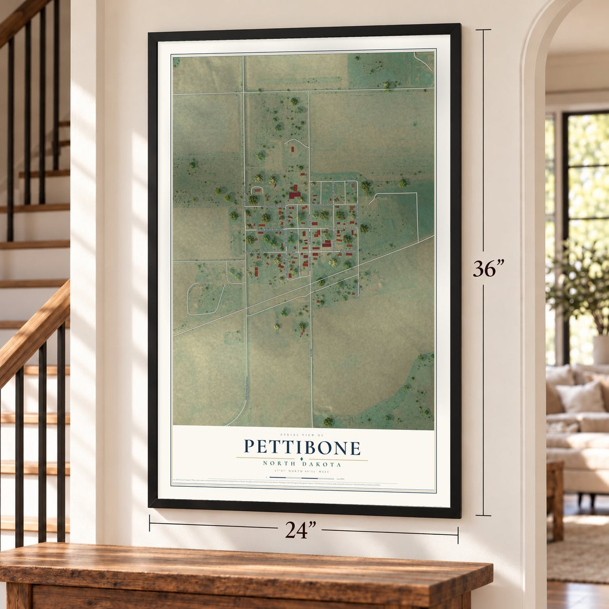 Pettibone, North Dakota map, 24 x 36 inch print in a black frame by a staircase
