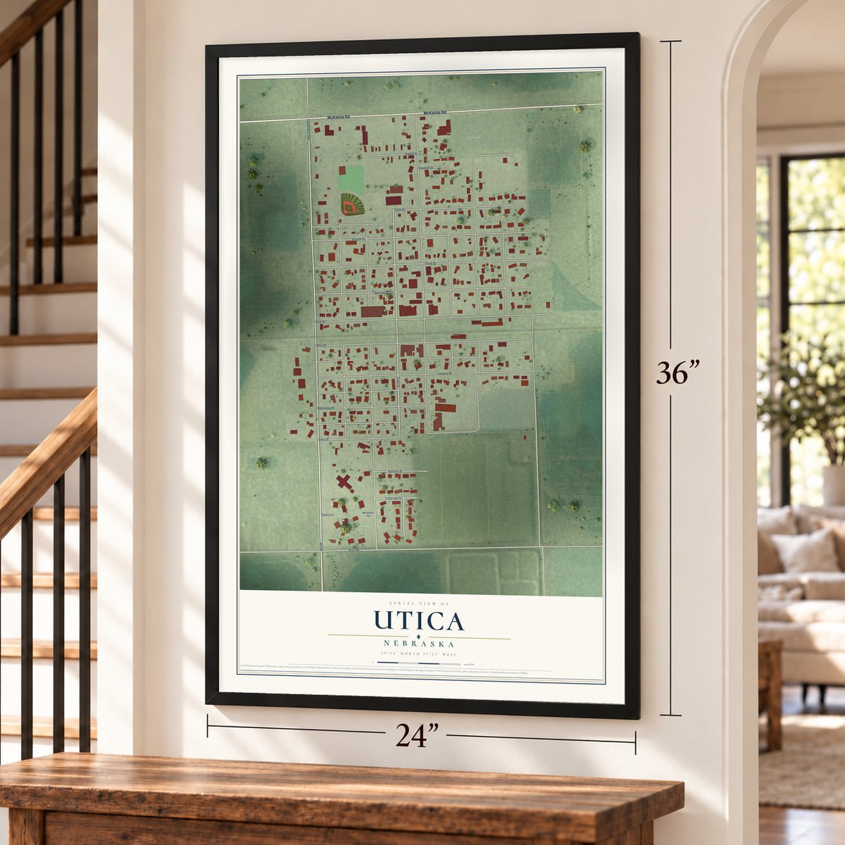 Utica, Nebraska map, 24 x 36 inch print in a black frame by a staircase