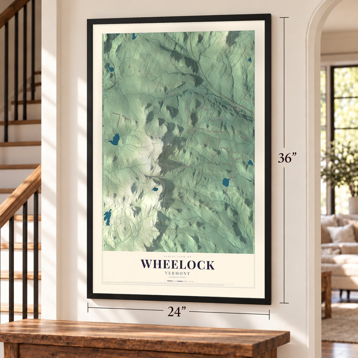 Wheelock, Vermont map, 24 x 36 inch print in a black frame by a staircase