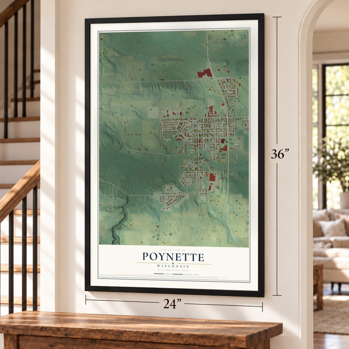 Poynette, Wisconsin map, 24 x 36 inch print in a black frame by a staircase