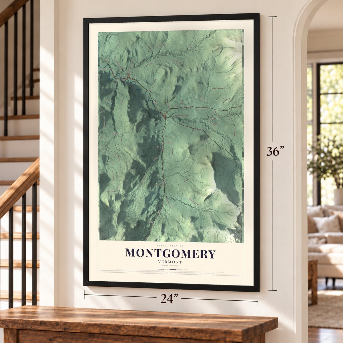 Montgomery, Vermont map, 24 x 36 inch print in a black frame by a staircase
