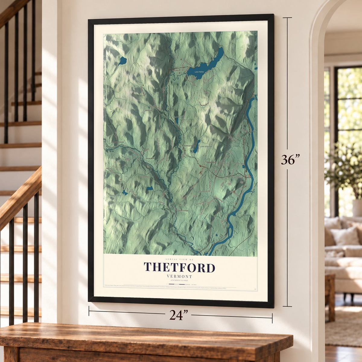 Thetford, Vermont map, 24 x 36 inch print in a black frame by a staircase