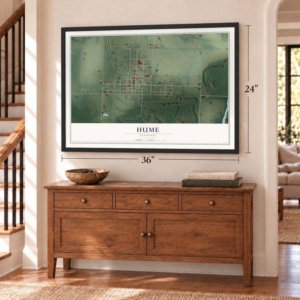 Hume, Missouri map, 24 x 36 inch print in a black frame above a dresser by a staircase