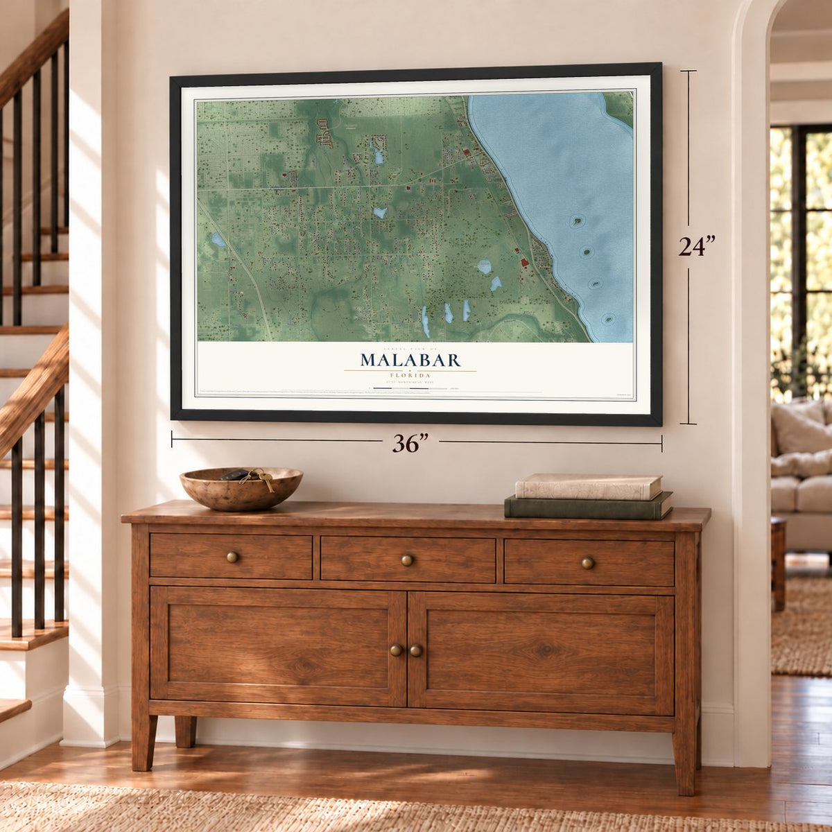 Malabar, Florida map, 24 x 36 inch print in a black frame above a dresser by a staircase