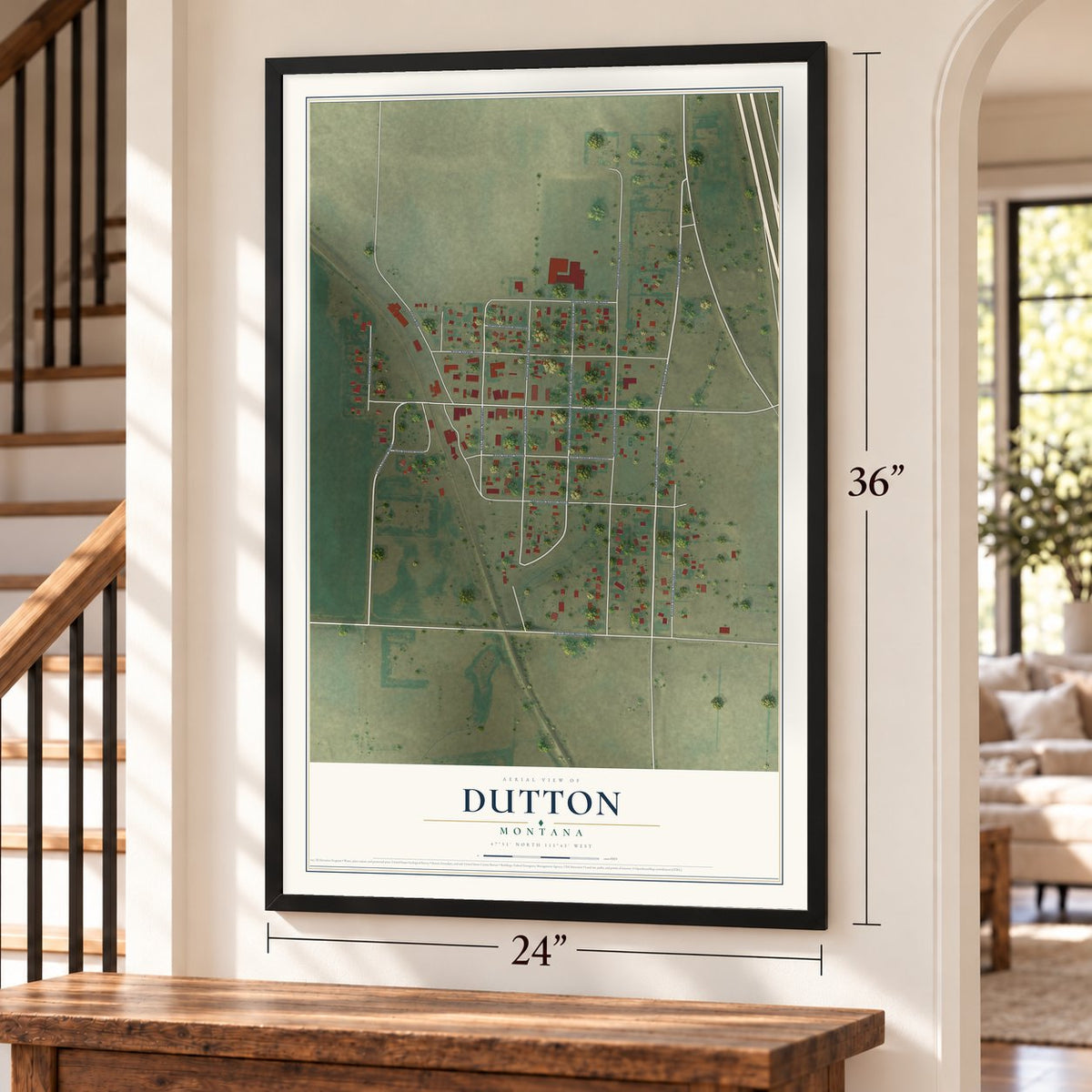 Dutton, Montana map, 24 x 36 inch print in a black frame by a staircase