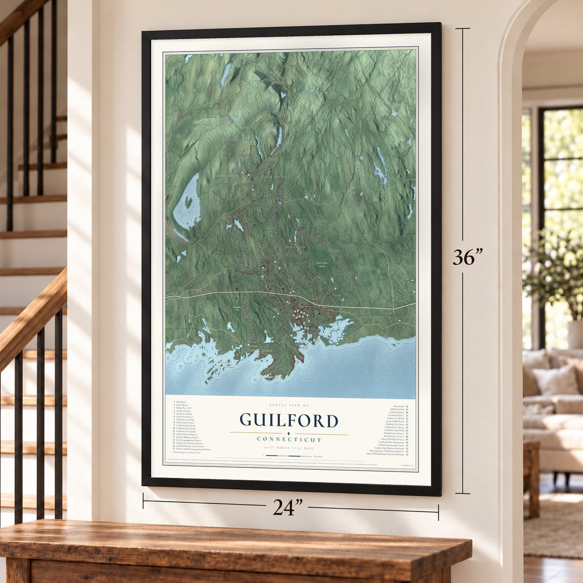 Guilford, Connecticut map, 24 x 36 inch print in a black frame by a staircase