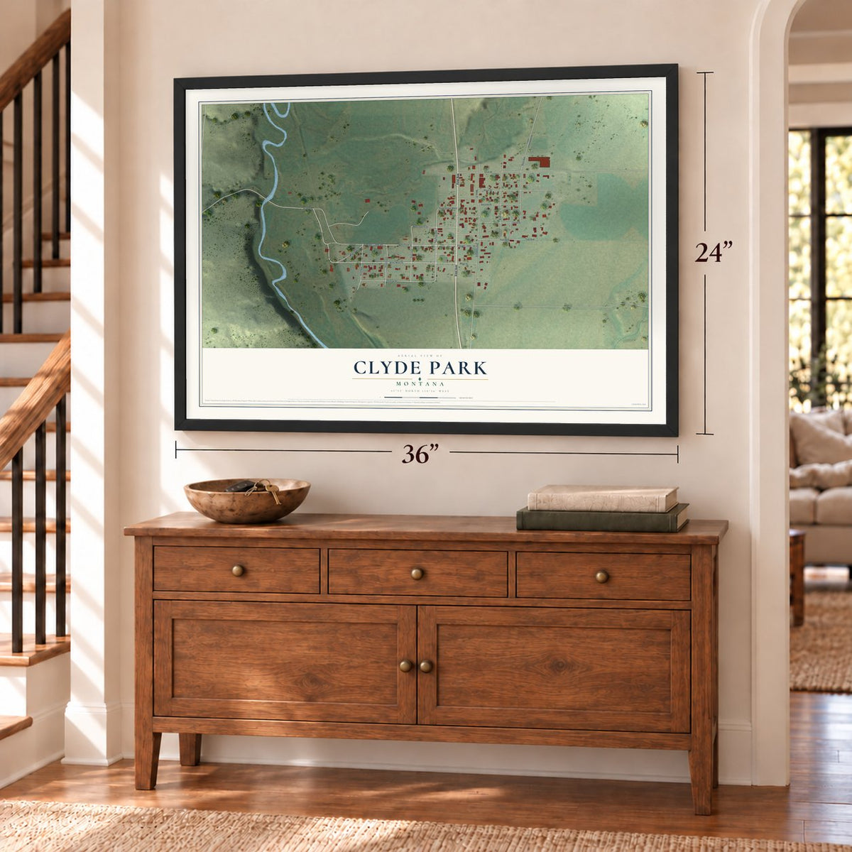 Clyde Park, Montana map, 24 x 36 inch print in a black frame above a dresser by a staircase
