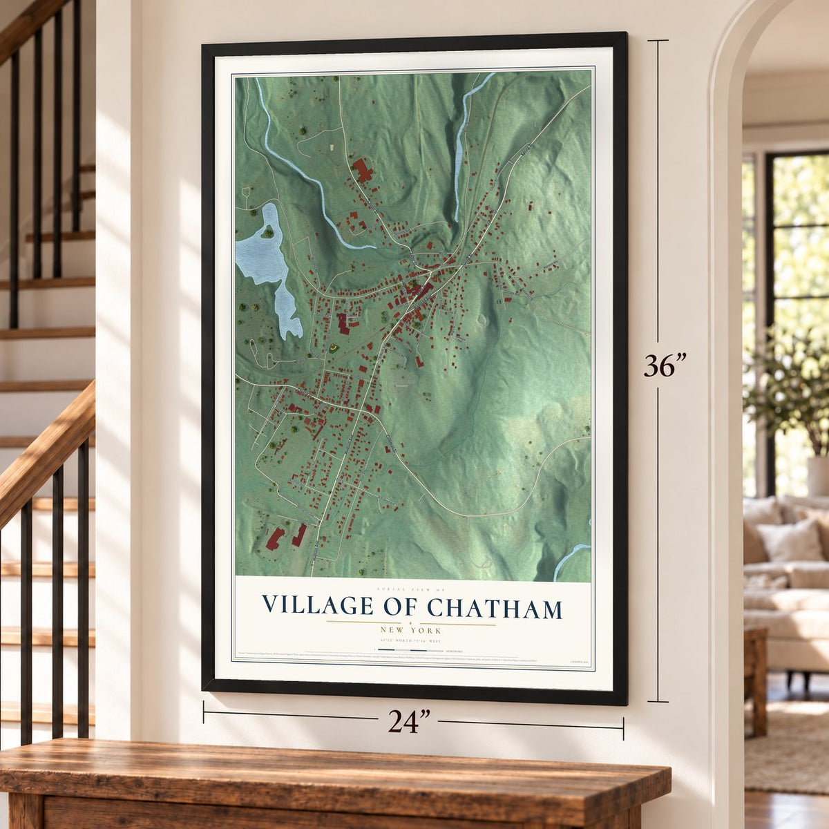 Village of Chatham, New York map, 24 x 36 inch print in a black frame by a staircase