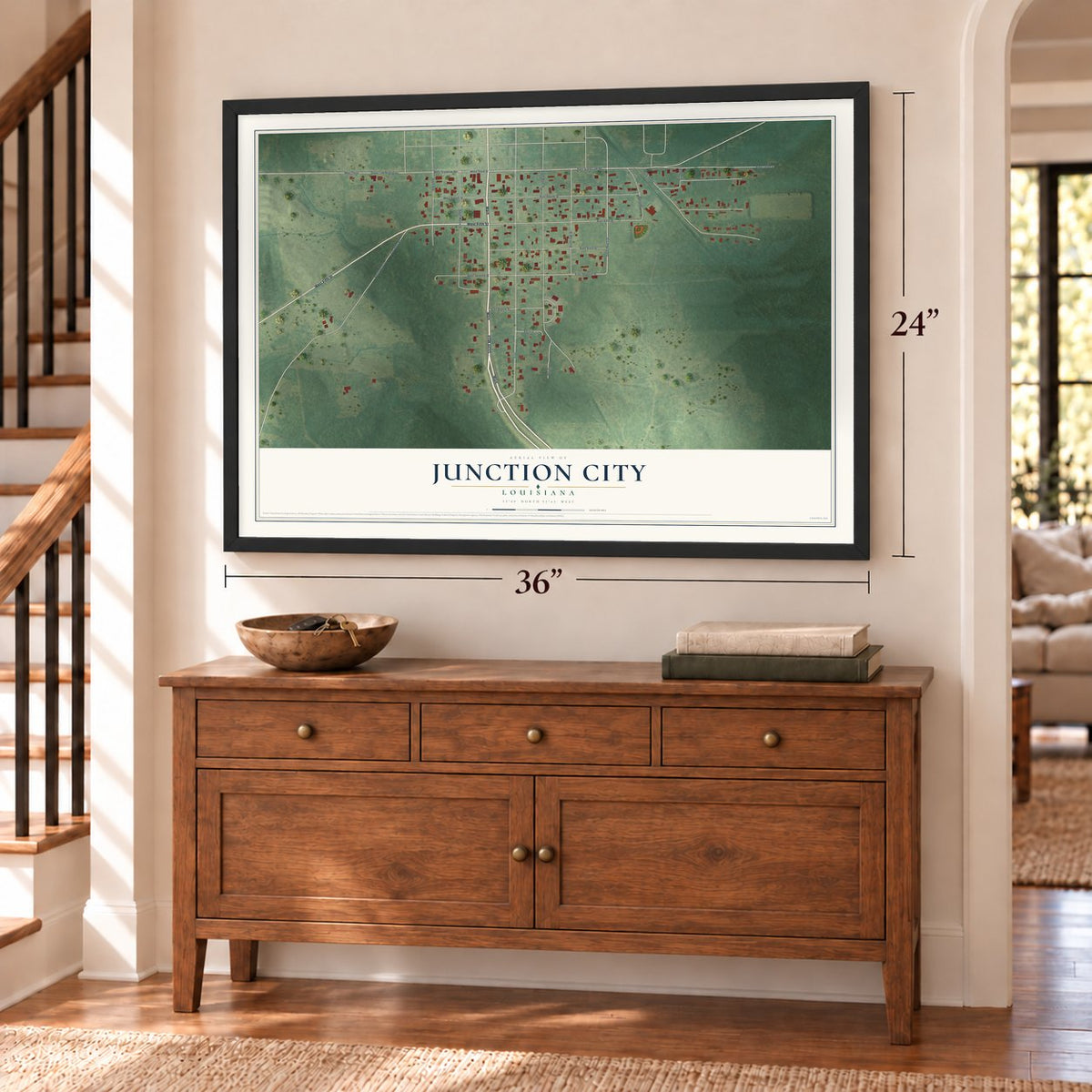 Junction City, Louisiana map, 24 x 36 inch print in a black frame above a dresser by a staircase