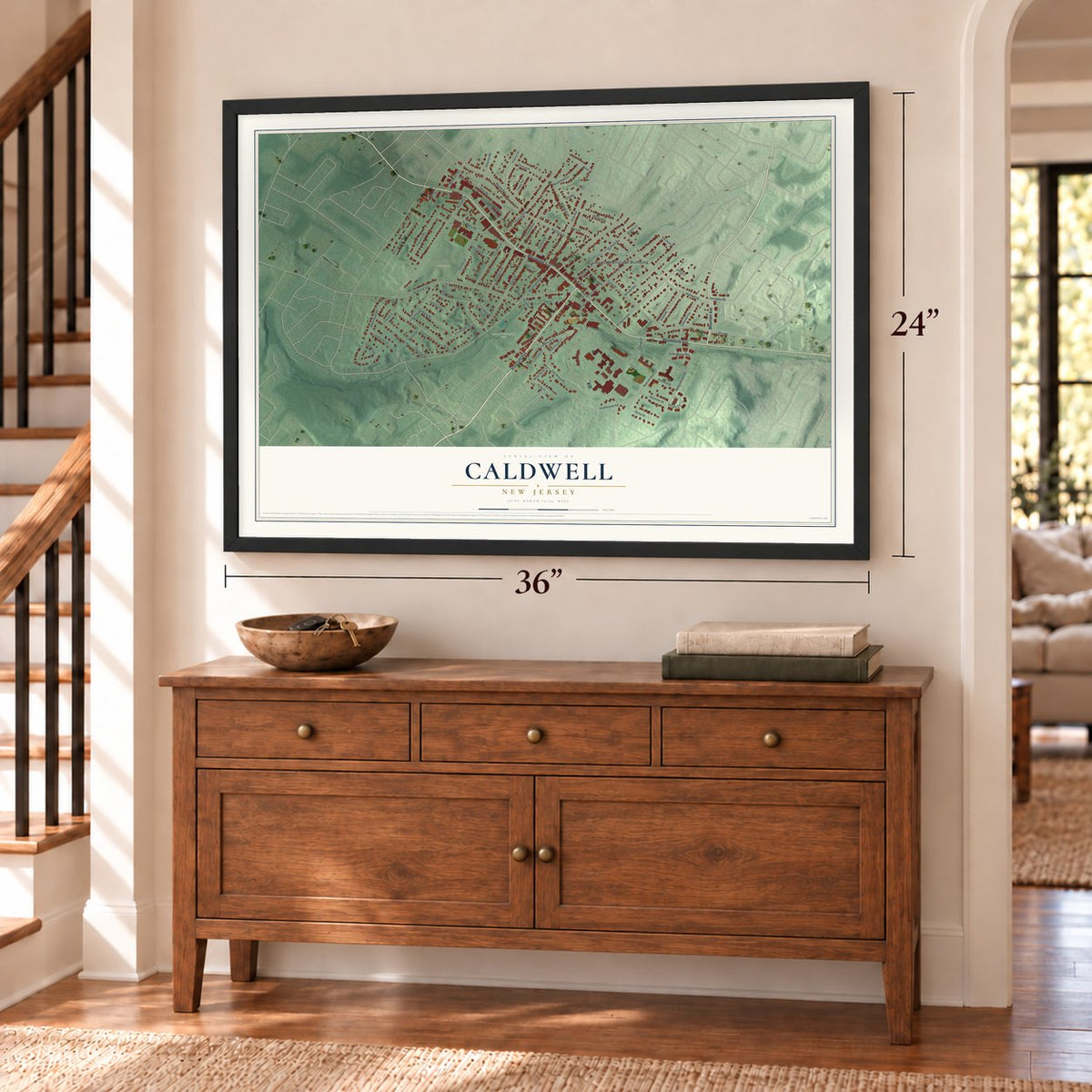 Caldwell, New Jersey map, 24 x 36 inch print in a black frame above a dresser by a staircase