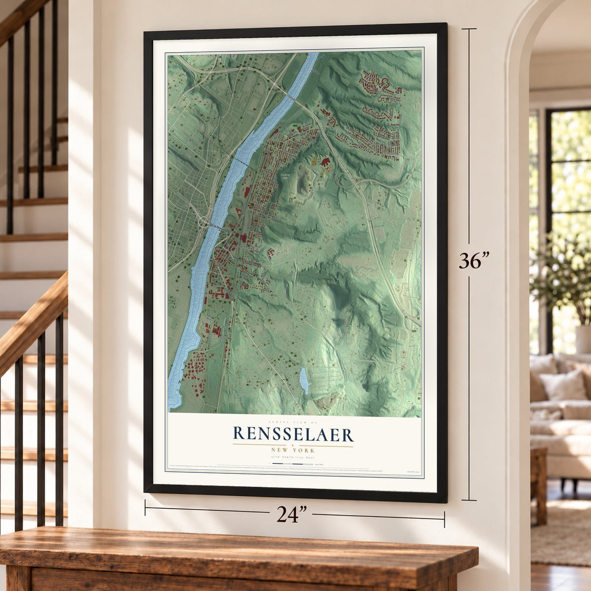 Rensselaer, New York map, 24 x 36 inch print in a black frame by a staircase