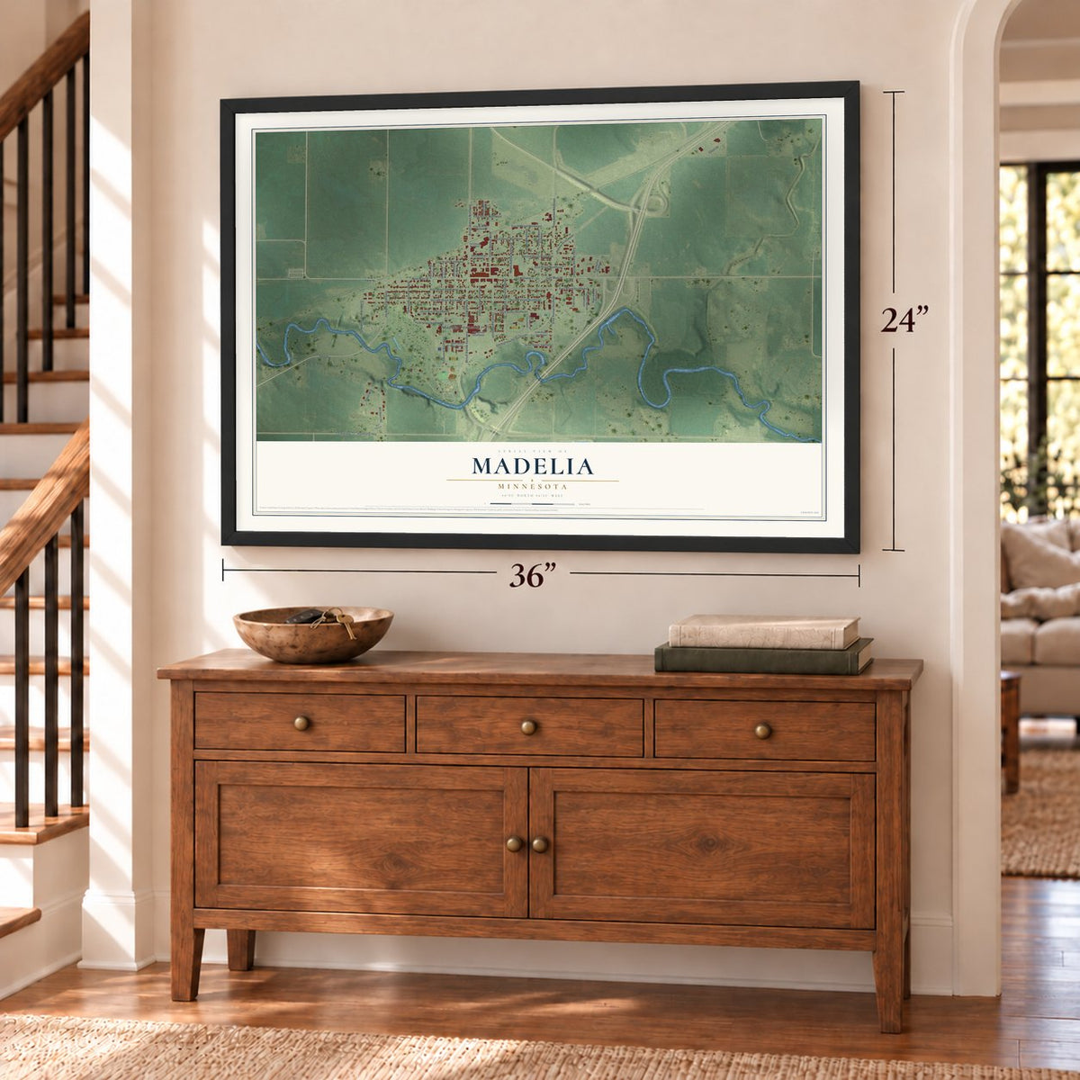 Madelia, Minnesota map, 24 x 36 inch print in a black frame above a dresser by a staircase