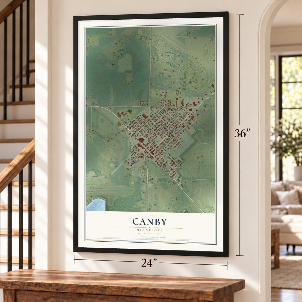 Canby, Minnesota map, 24 x 36 inch print in a black frame by a staircase