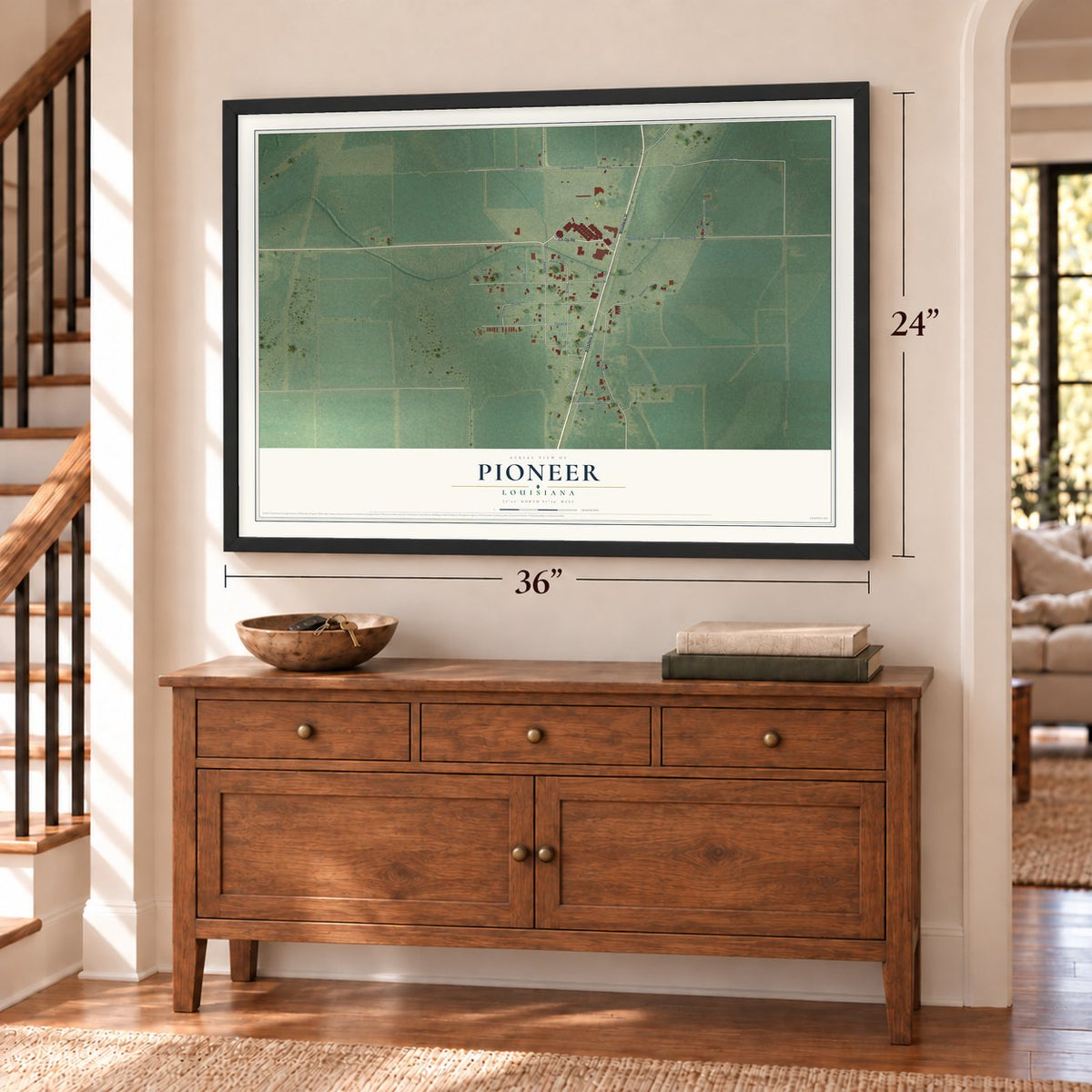 Pioneer, Louisiana map, 24 x 36 inch print in a black frame above a dresser by a staircase